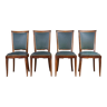 Ensemble art déco de quatre chaises en bois et similicuir vert jaguar, vers 1950