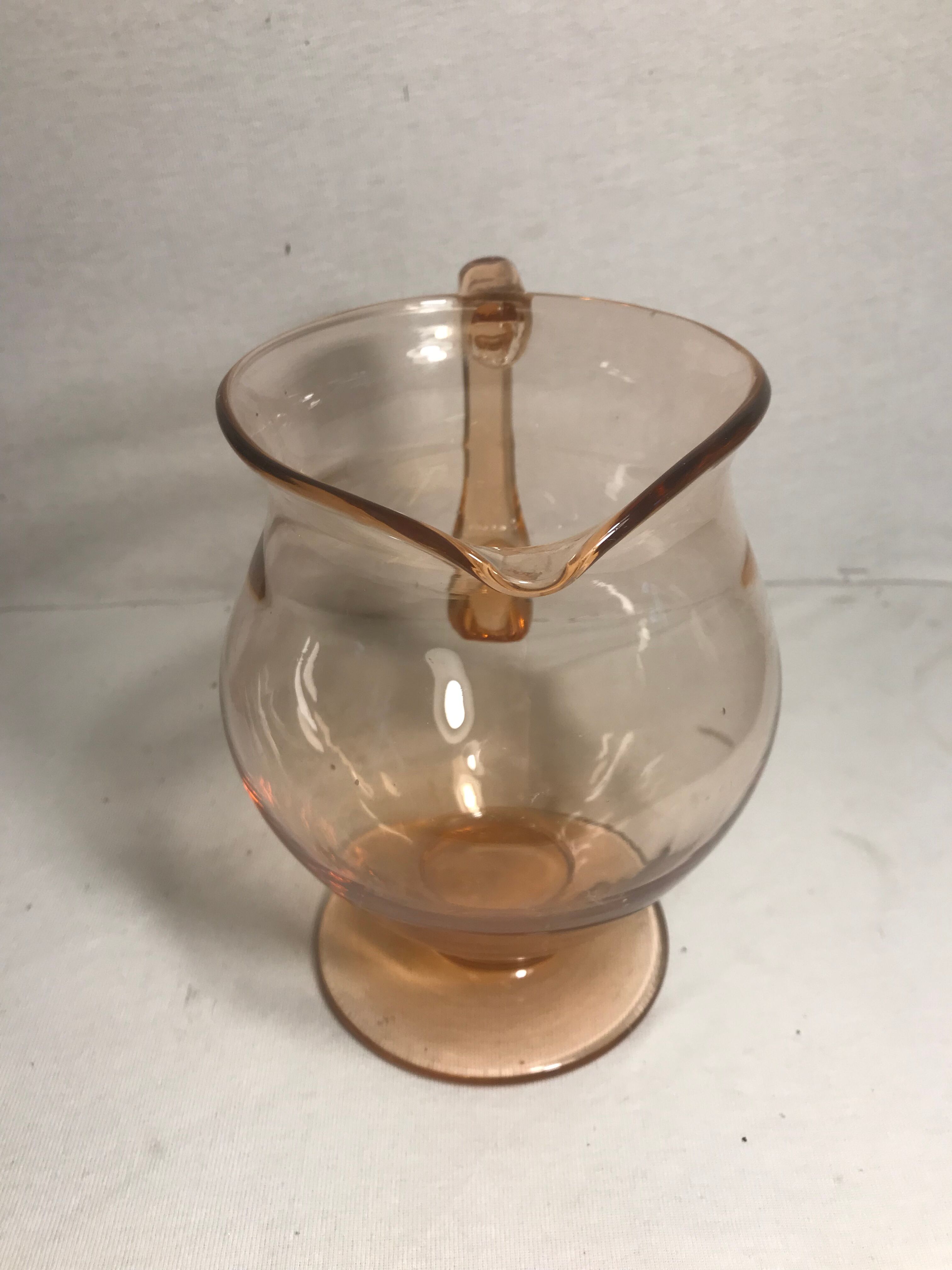 Pink pitcher in bubble glass