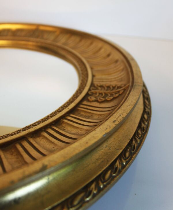 Miroir soleil en bois sculpté doré, style Empire, 60’s.