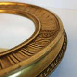 Sun mirror in carved gilded wood, Empire style, 60s.