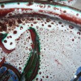 Frying pan with fat lava and ceramic fish decor