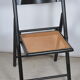 Folding chair seated in cannage
