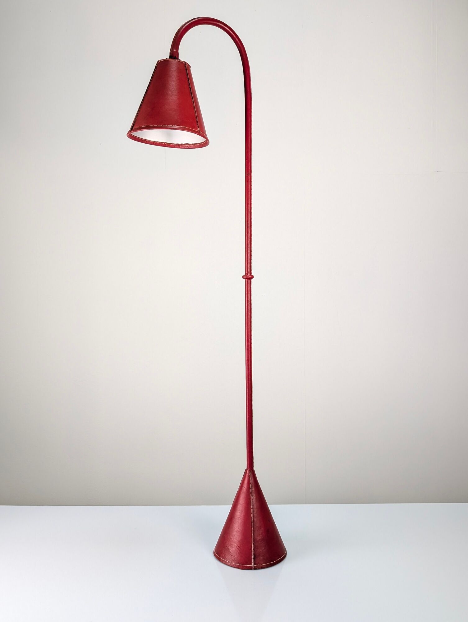 Jacques Adnet floor lamp in red leather, mid-century modern, France, 1960s