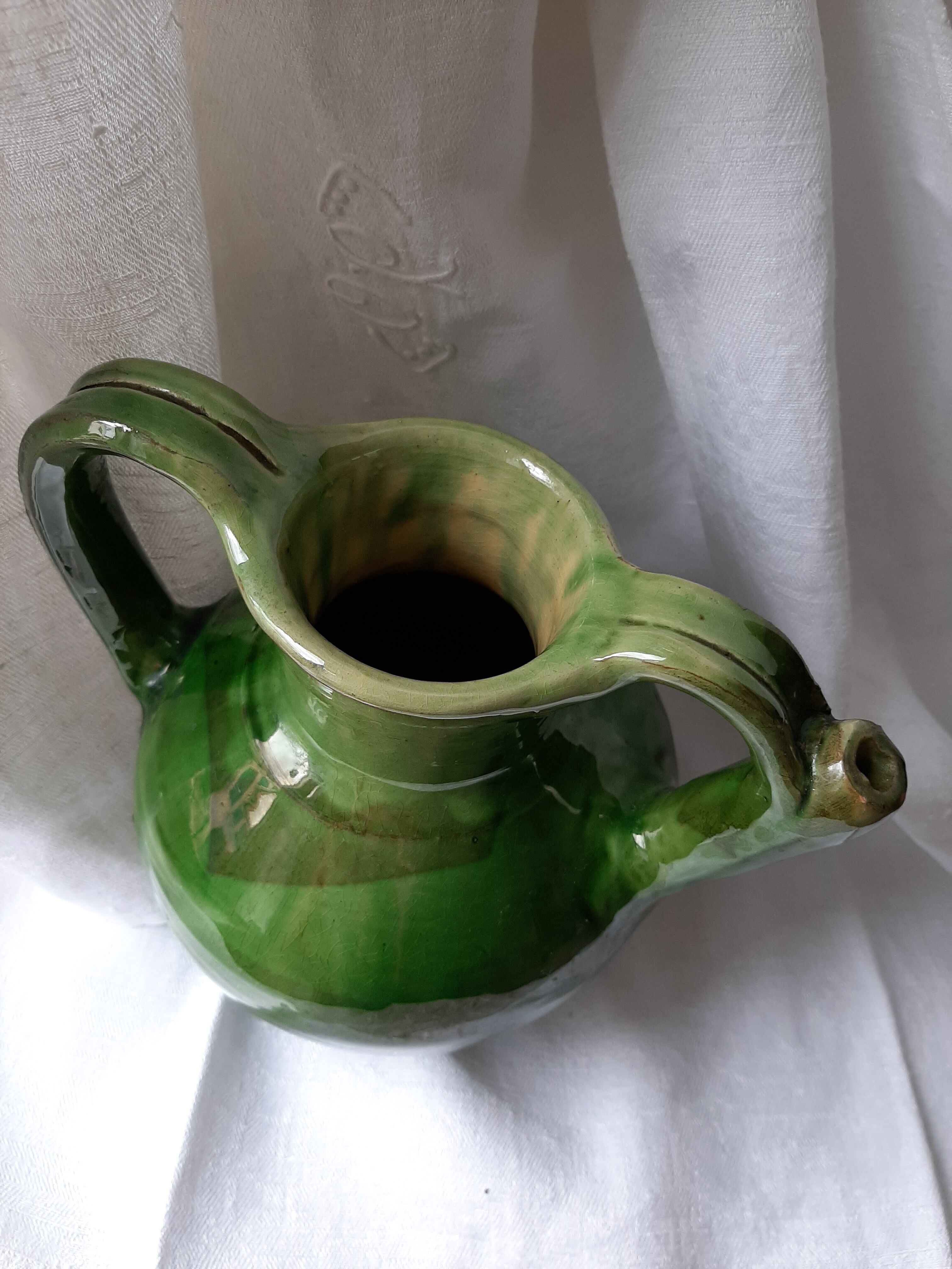 Old glazed terracotta pitcher