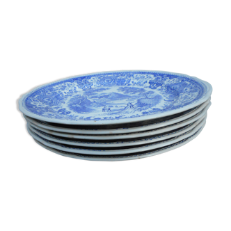 Six flat plates in blue and white earthenware
