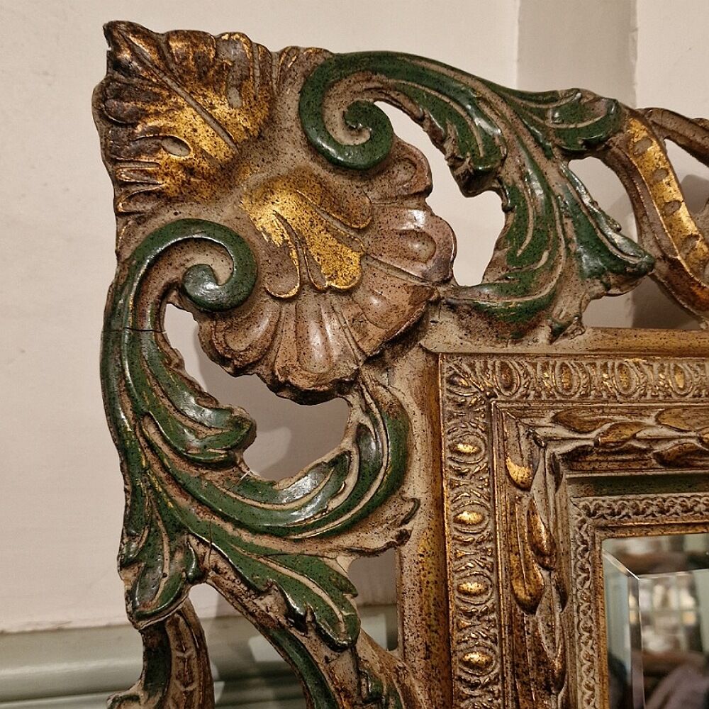 Bevelled mirror and carved wood