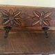 Small antique wooden bench with a folding backrest.