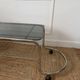 Table basse en métal et verre fumé 1970