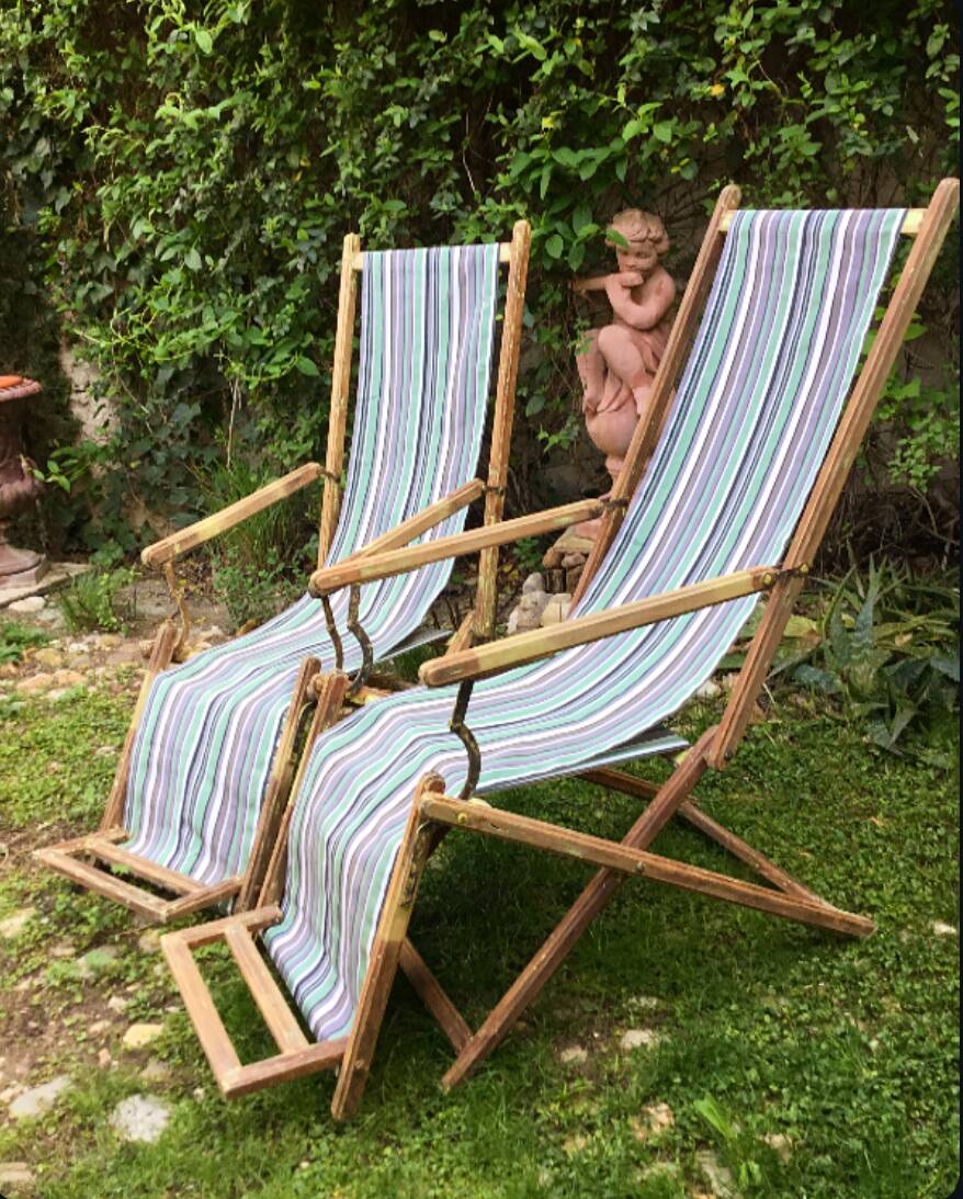Pair of 19th-century wooden deck chairs with pegged frames and wrought iron
