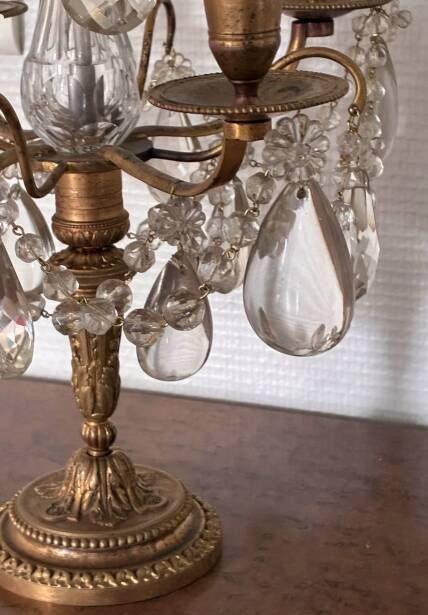 Candle holder or candelabrum with four arms of light.