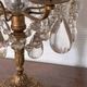 Candle holder or candelabrum with four arms of light.