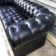 Canapé noir Chesterfield