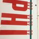 Phildard enamelled plaque White background red letters