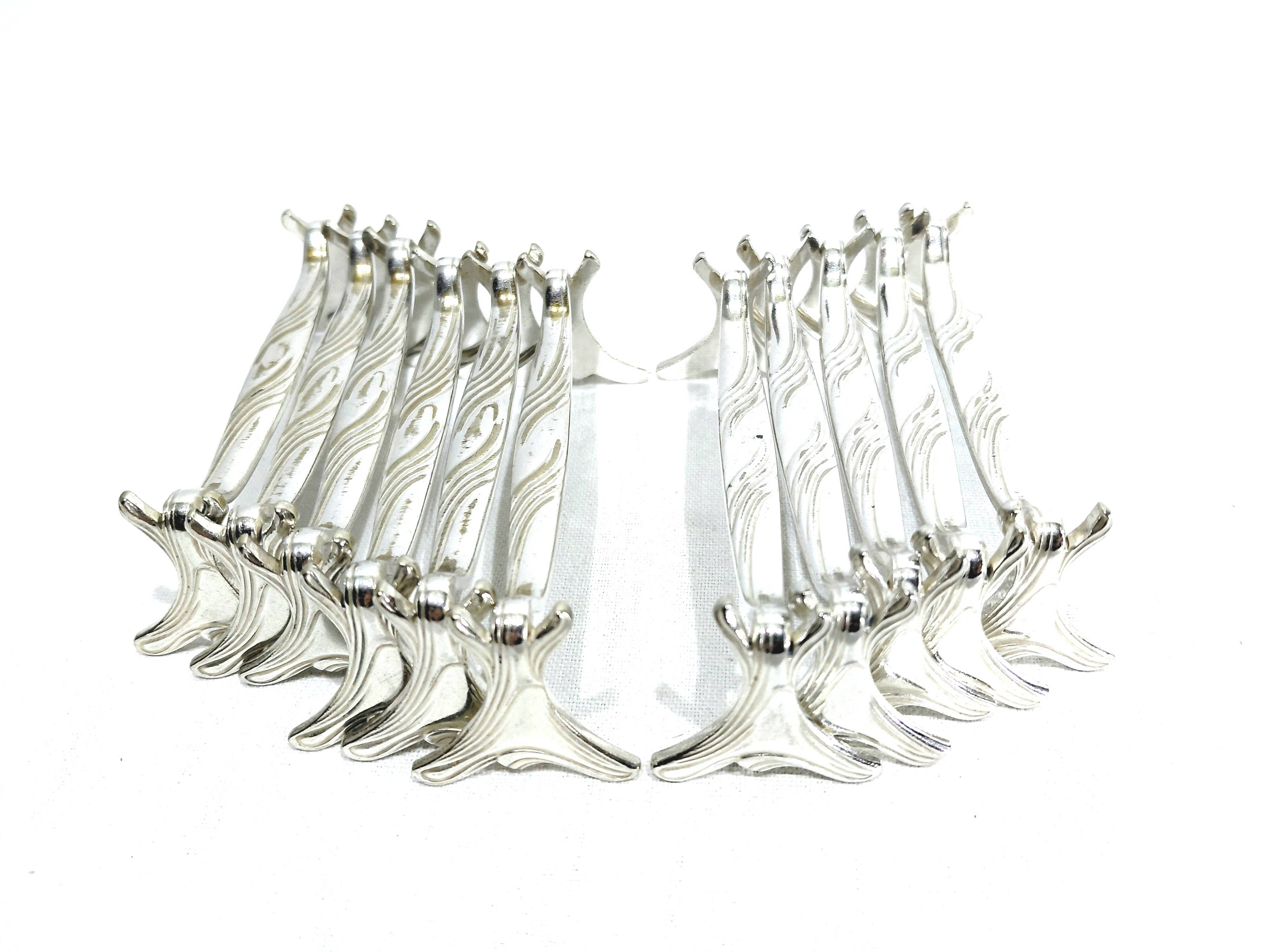 CHRISTOFLE - SET OF 11 SILVER-PLATED KNIFE RESTS