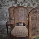 Set of 6 antique Louis XVI style dining chairs with caning.