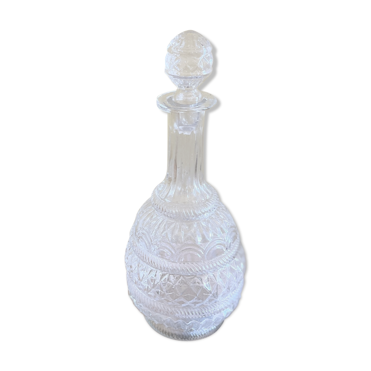 Blown glass decanter and relief decoration