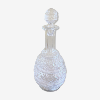 Blown glass decanter and relief decoration