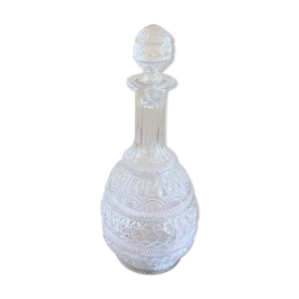 Blown glass decanter and relief decoration