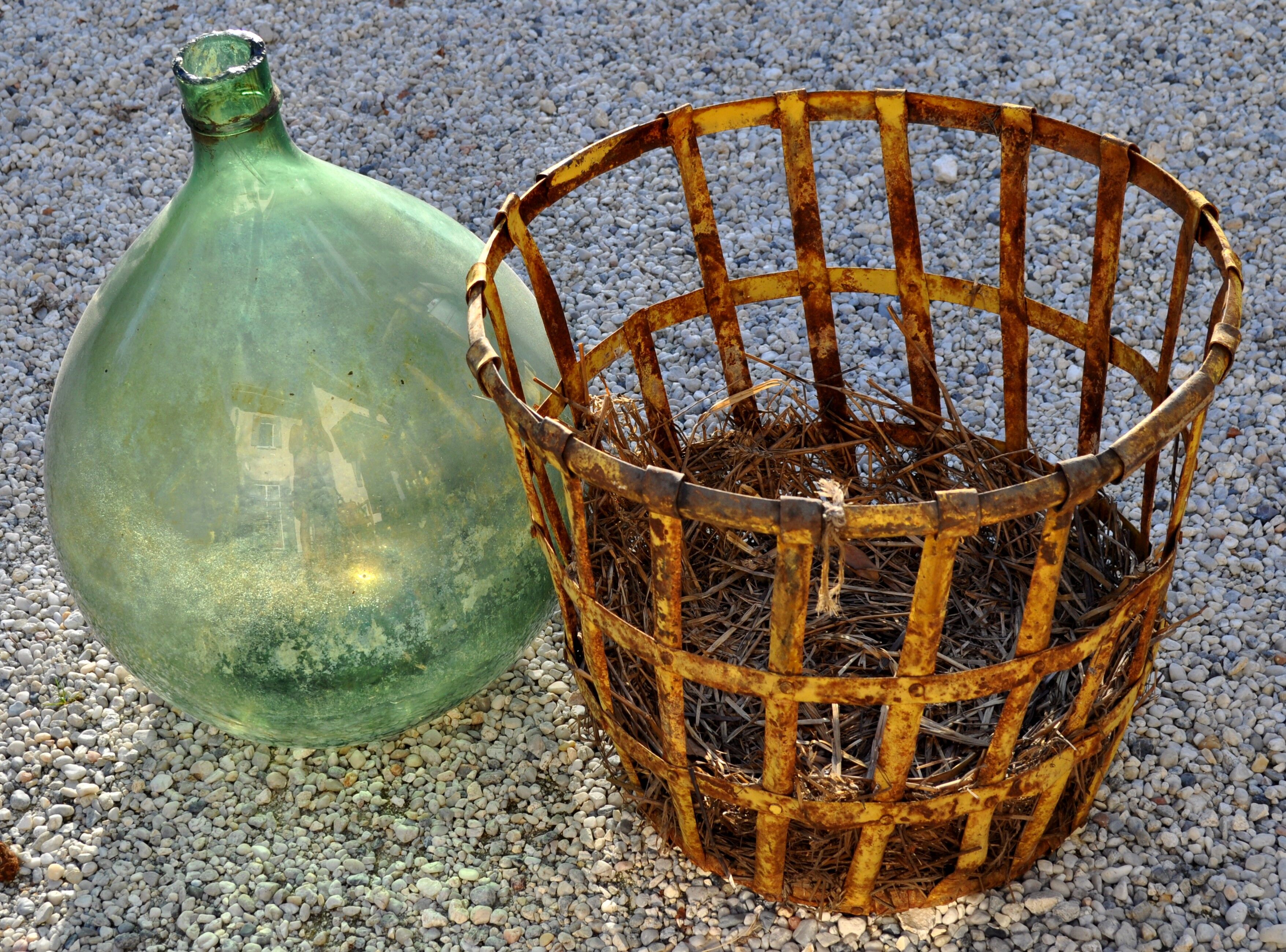 Demijohn in his iron cager