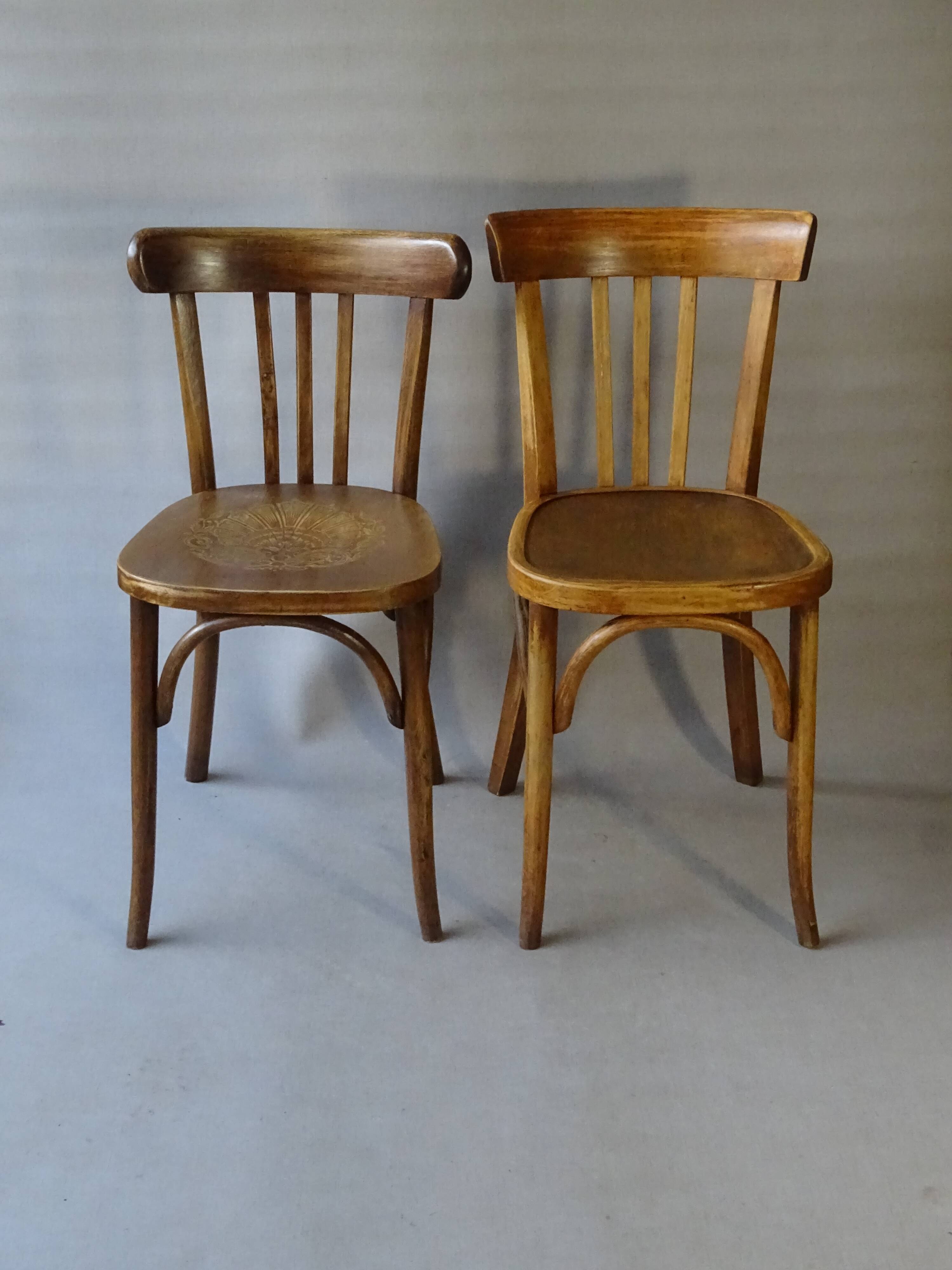 Set of 36 mismatched Bistrot chairs, 1920 to 1950, wooden seats.