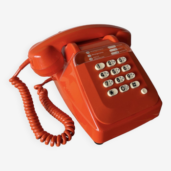 Orange Socotel telephone with buttons from the 80s