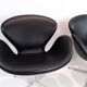 A pair of Swan chairs, model 3320, designed by Arne Jacobsen in 1958