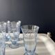 Set of 32 vintage glacier blue engraved stemmed glasses.