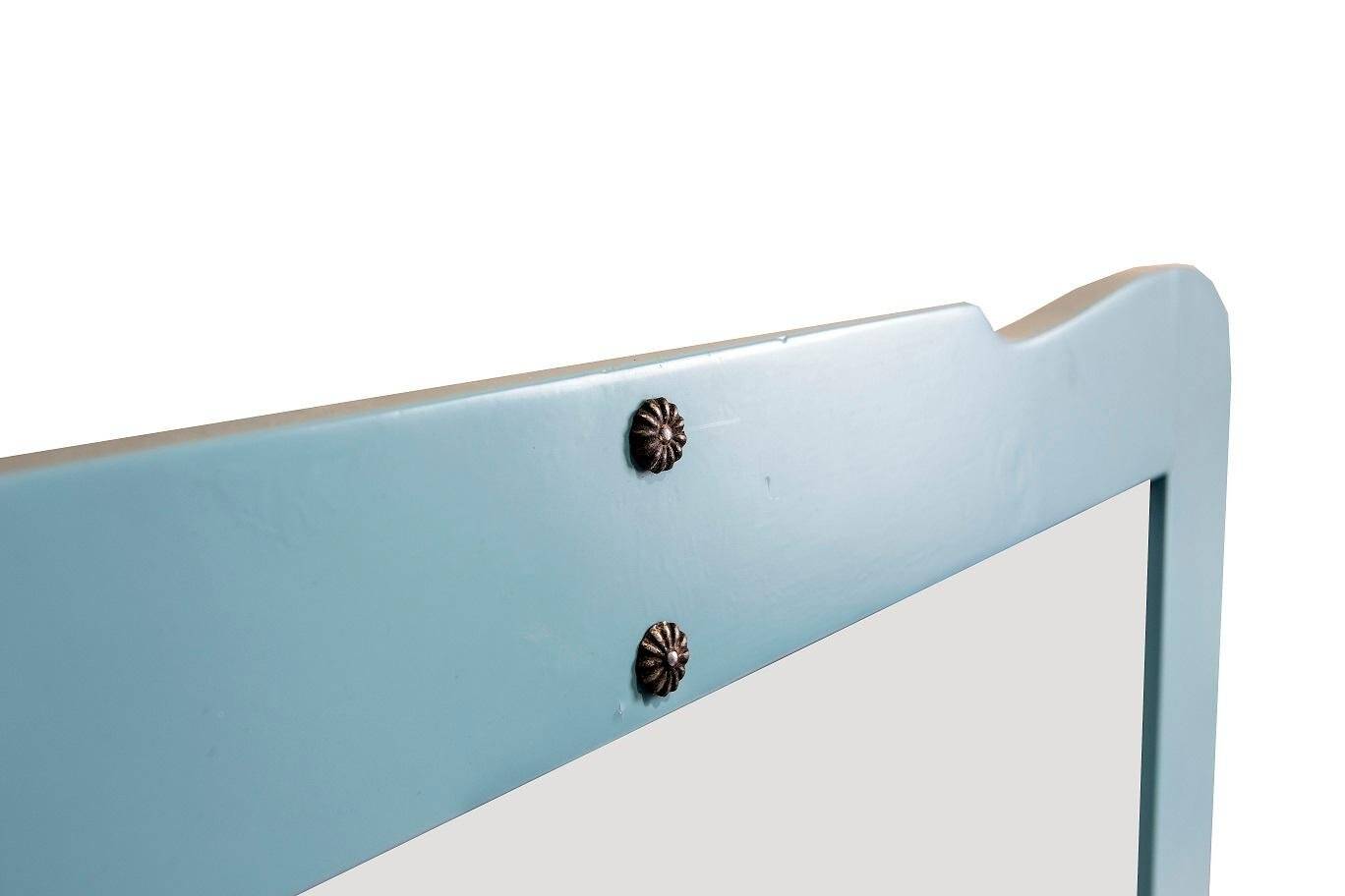 Large antique mirror with a solid wood frame painted turquoise and with red accents, mirror effect glass.