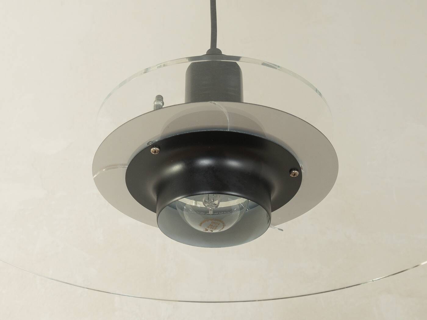 Space Age ceiling lamp by Ikea from the 1980s with two plexiglass plates and canopy made of black injection-moulded plastic.