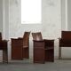 Set of 4 brown/red leather armchairs, Tito Agnoli, modern Italian, 1970s.