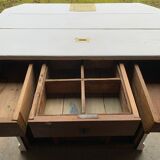 White counter with brass coin mechanism