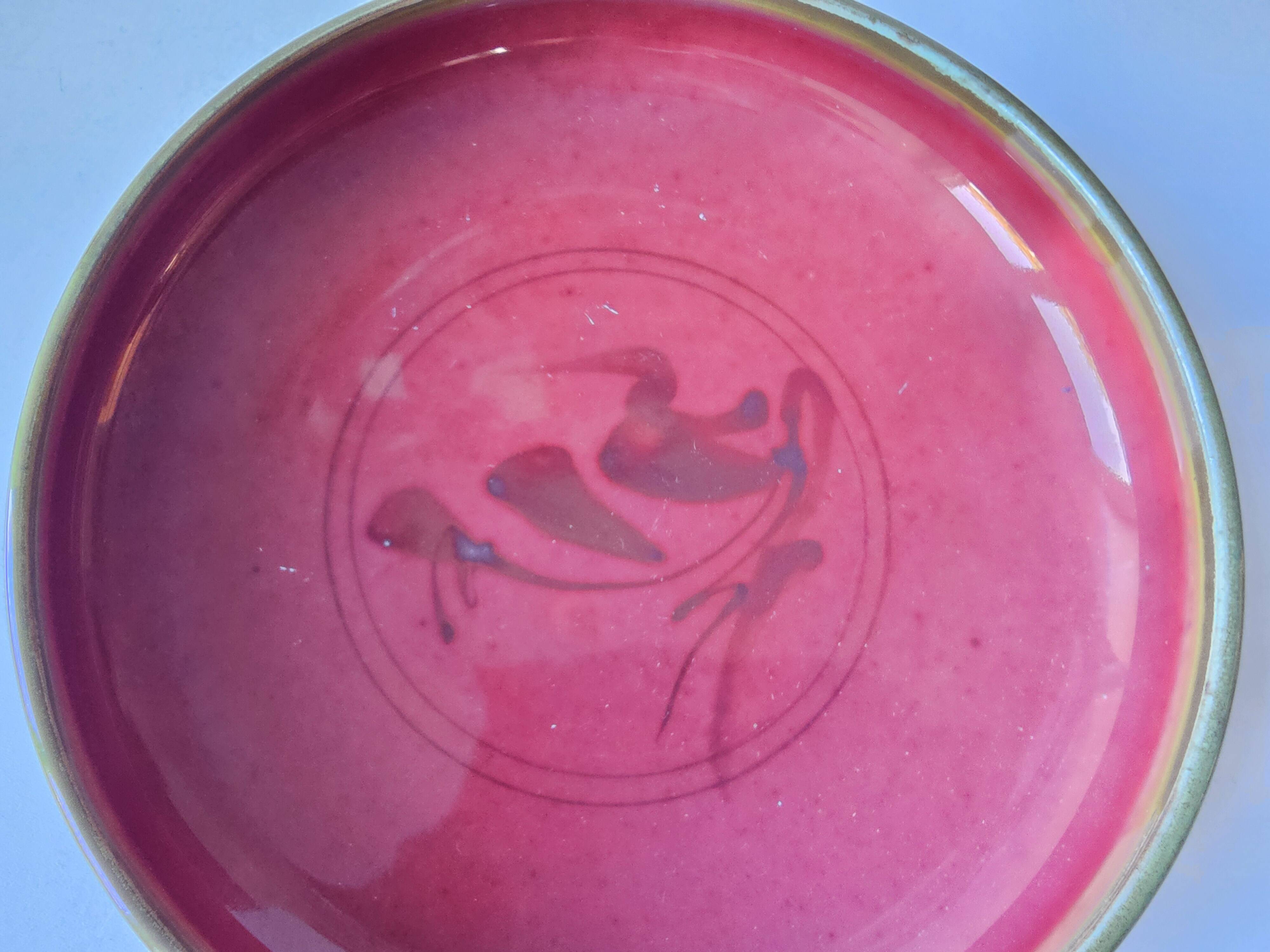 Red enamelled ceramic bowl emptier by Alain Déjardin