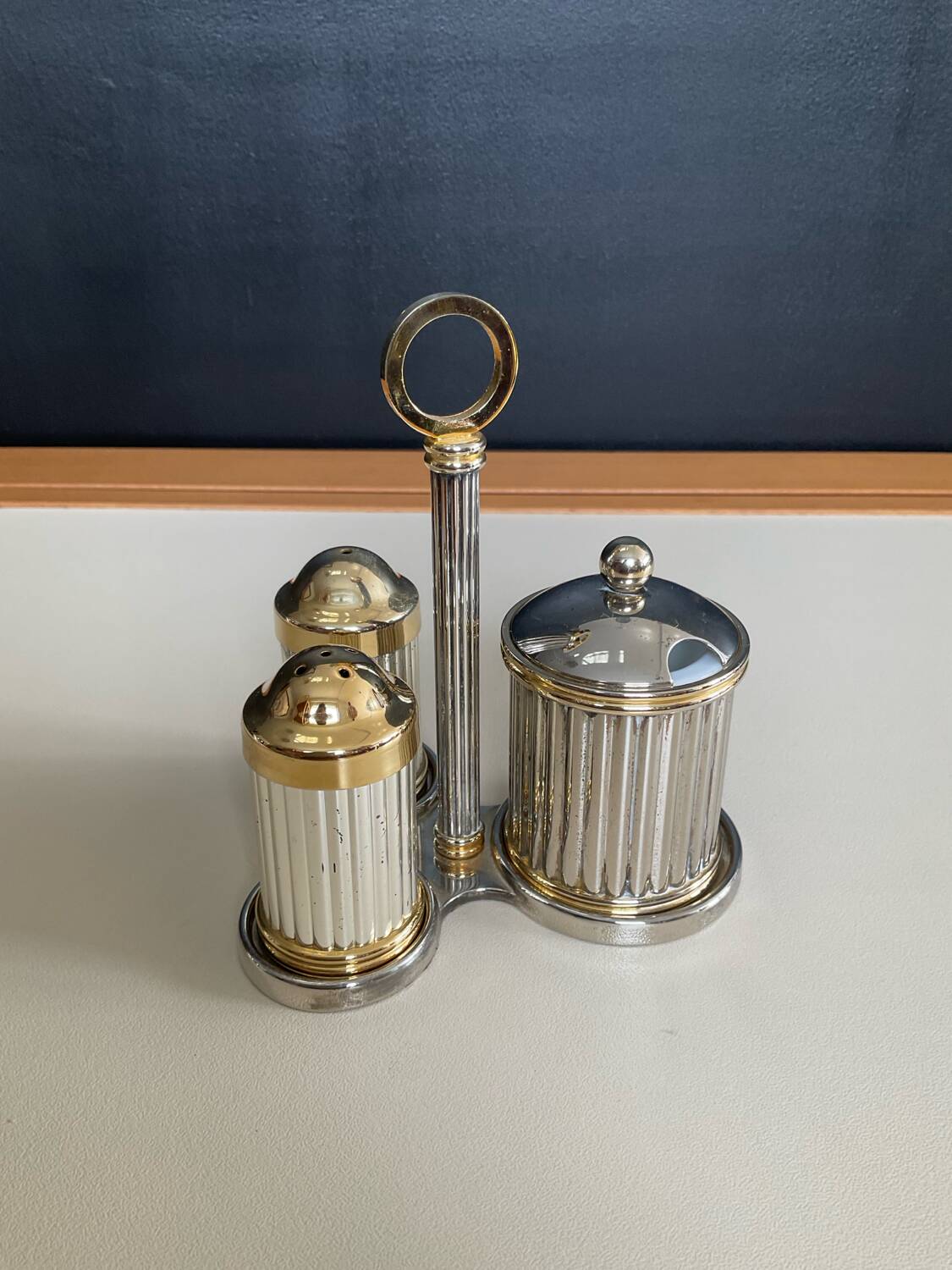 Vintage metal silver-plated and brass salt and pepper set.