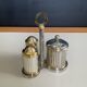 Vintage metal silver-plated and brass salt and pepper set.