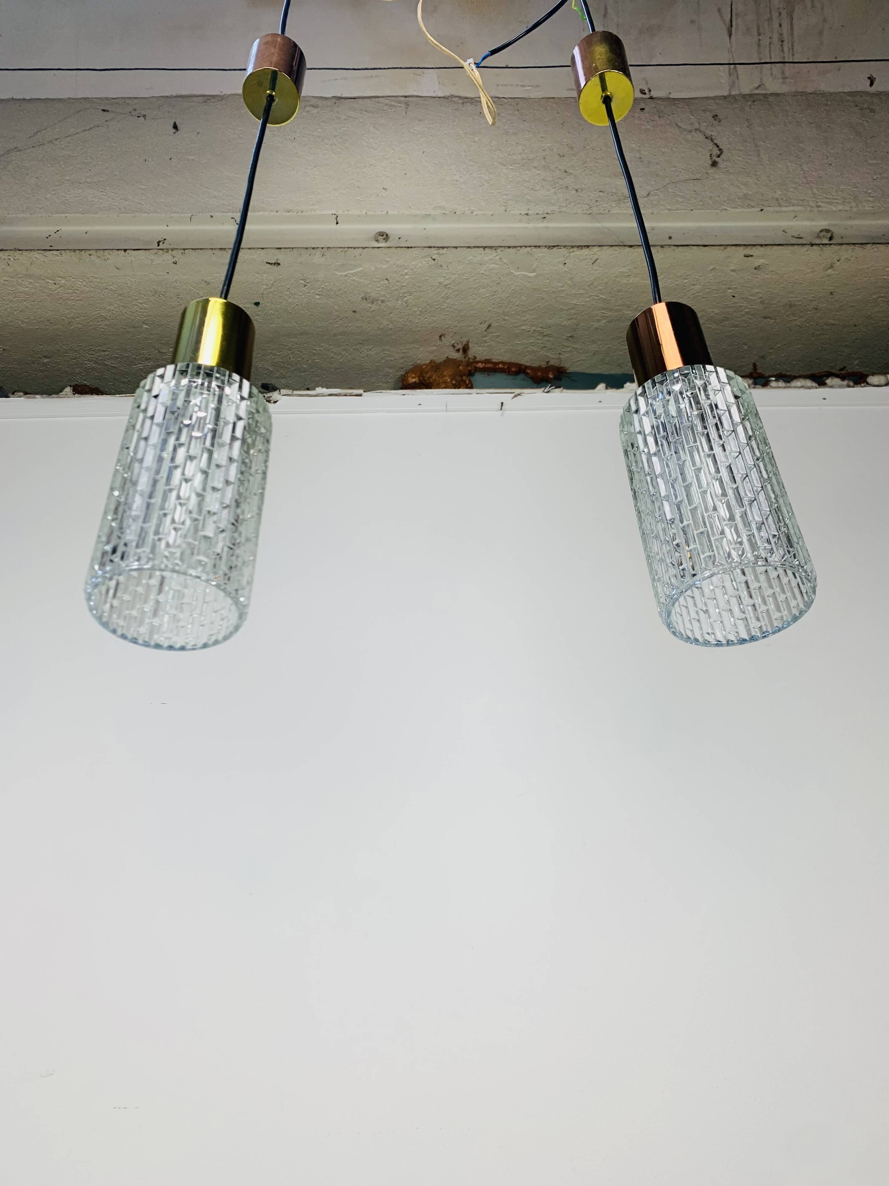 Pair of vintage cut glass pendant lights from the 1970s.