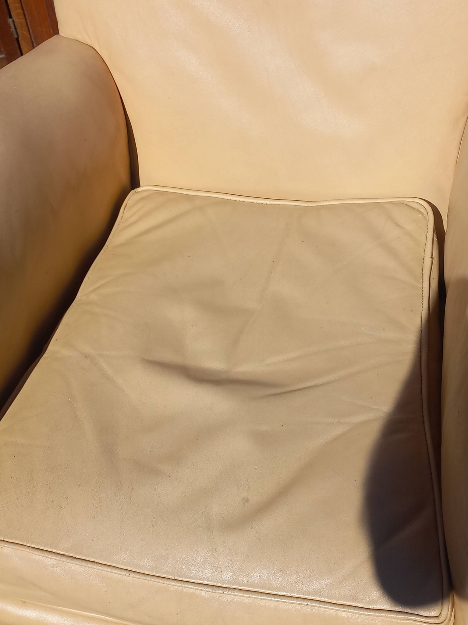 Pair of 1930s club armchairs in ivory leather.