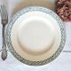 Old mismatched flat plates made of ironstone earthenware.