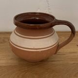 Hungarian folk ceramic pitcher in glossy brown and beige, traditional rounded pot.