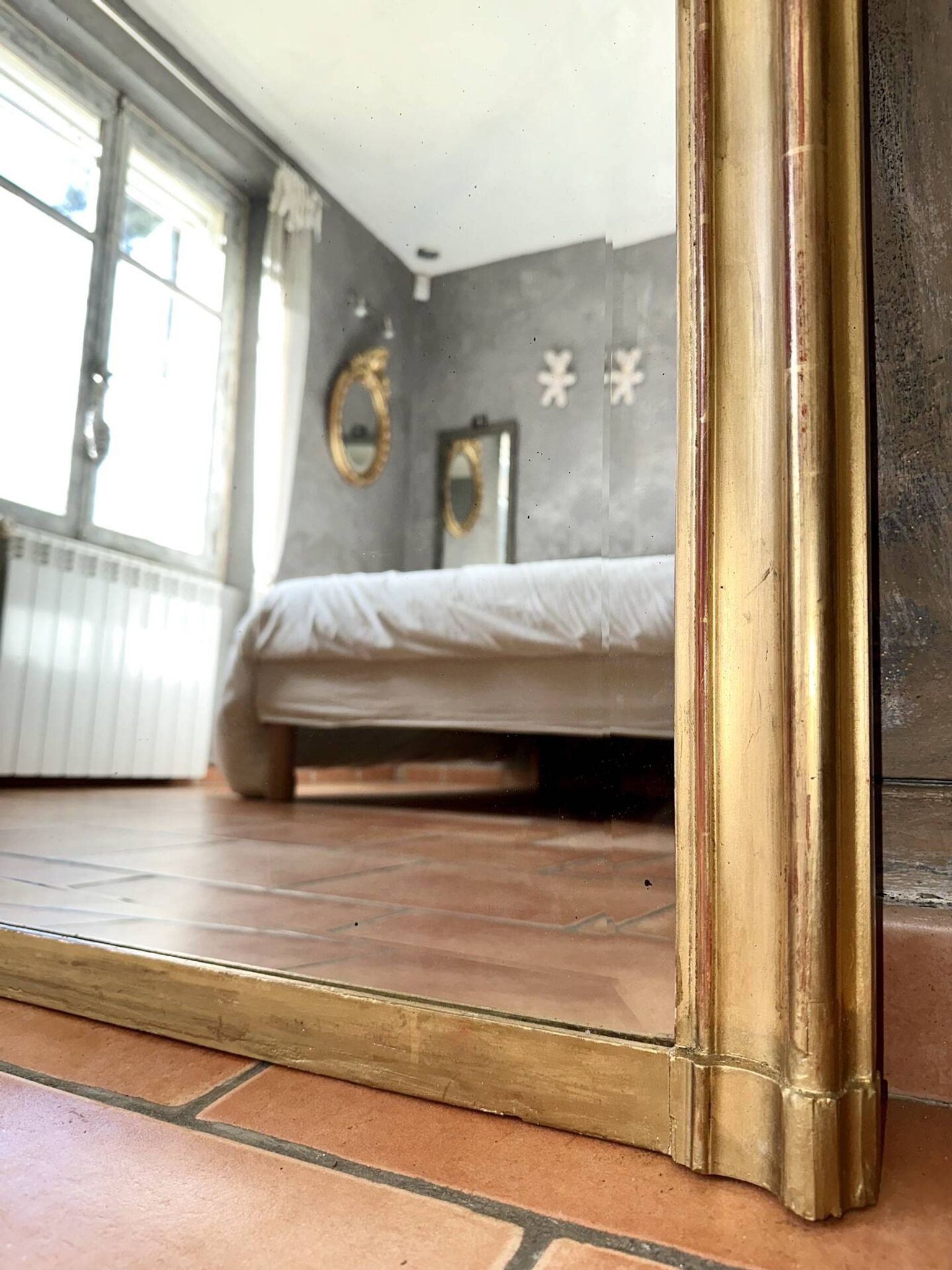 Antique gilded Louis XV pediment mirror