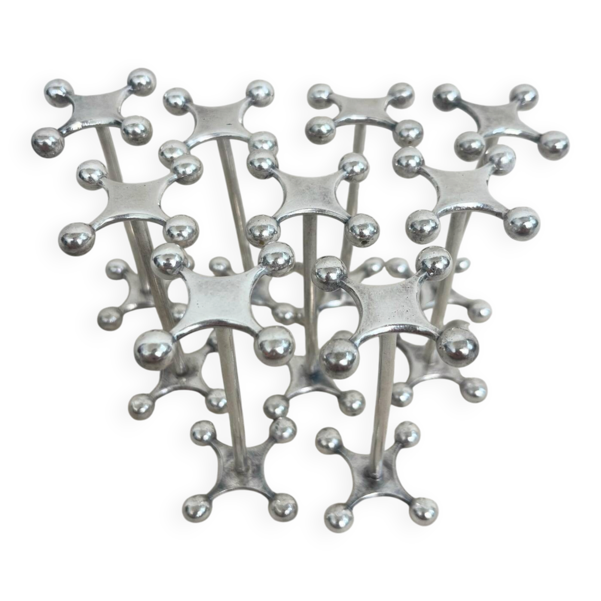 series of brutalist and sculptural silver-plated knife rests