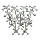 series of brutalist and sculptural silver-plated knife rests