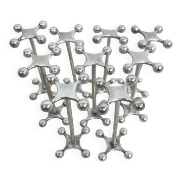 series of brutalist and sculptural silver-plated knife rests
