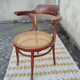 Caned chair with armrests attributed to Fischel