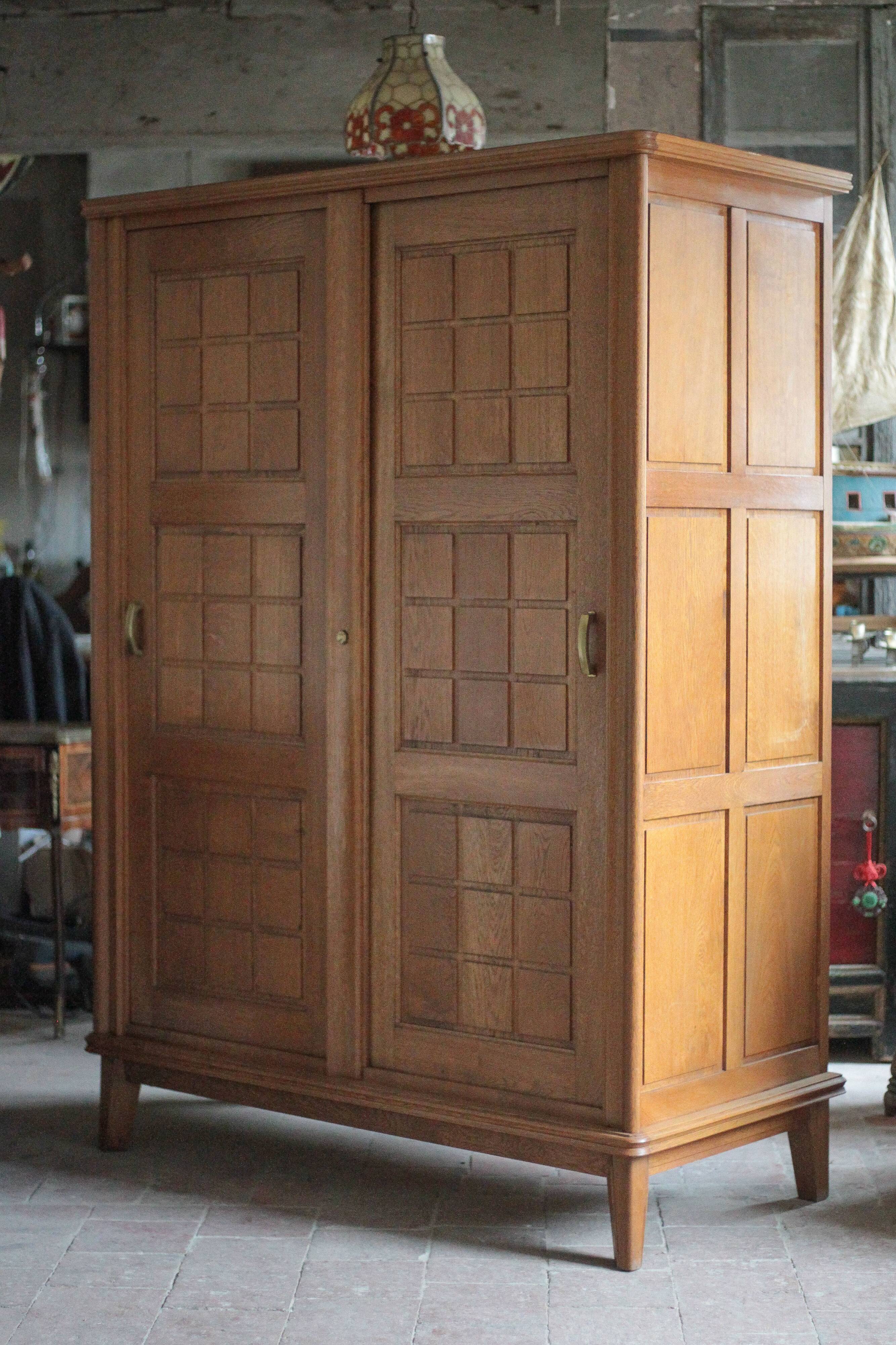 Vintage wooden wardrobe with sliding doors.