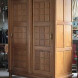 Vintage wooden wardrobe with sliding doors.