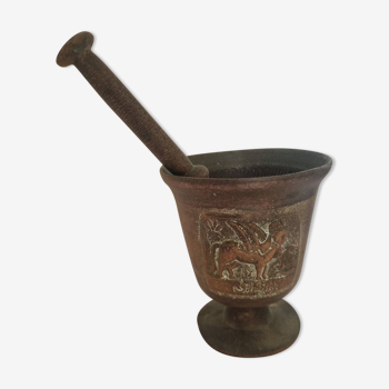 Antique mortar and pestle in bronze and vintage copper