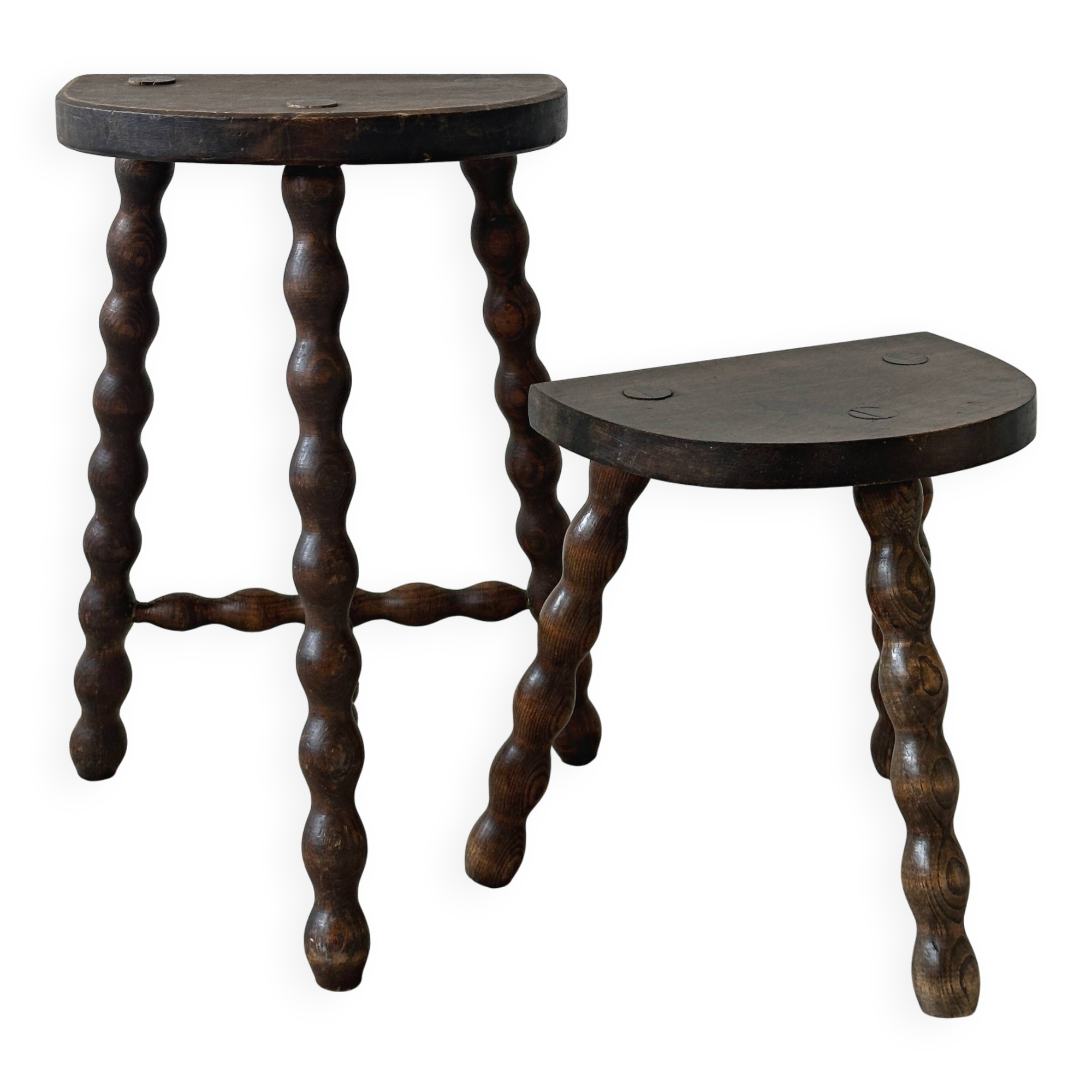 Two French farmhouse stools made of turned wood.