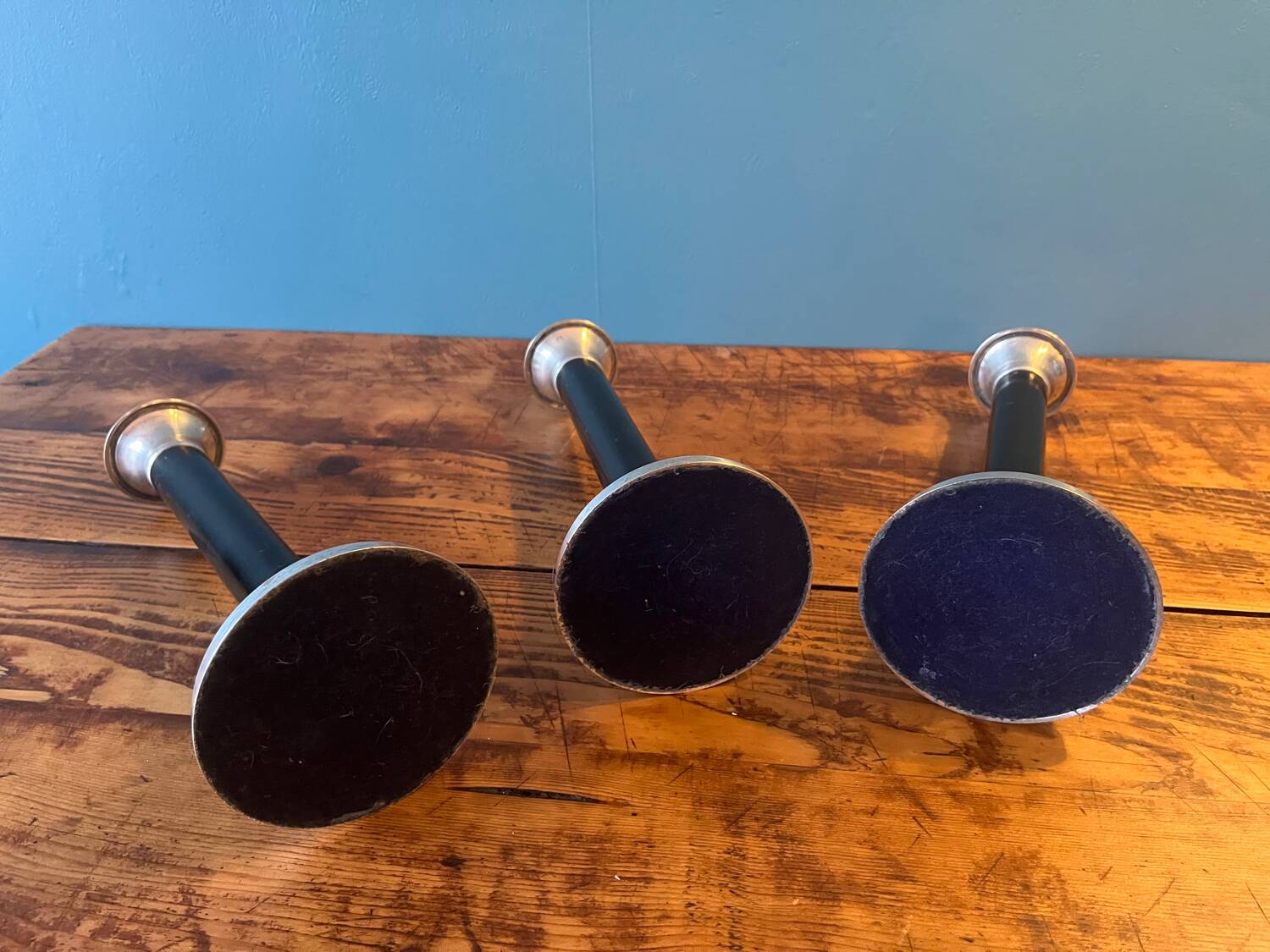 Trio of metal and wood candlesticks from the 80s