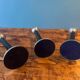 Trio of metal and wood candlesticks from the 80s