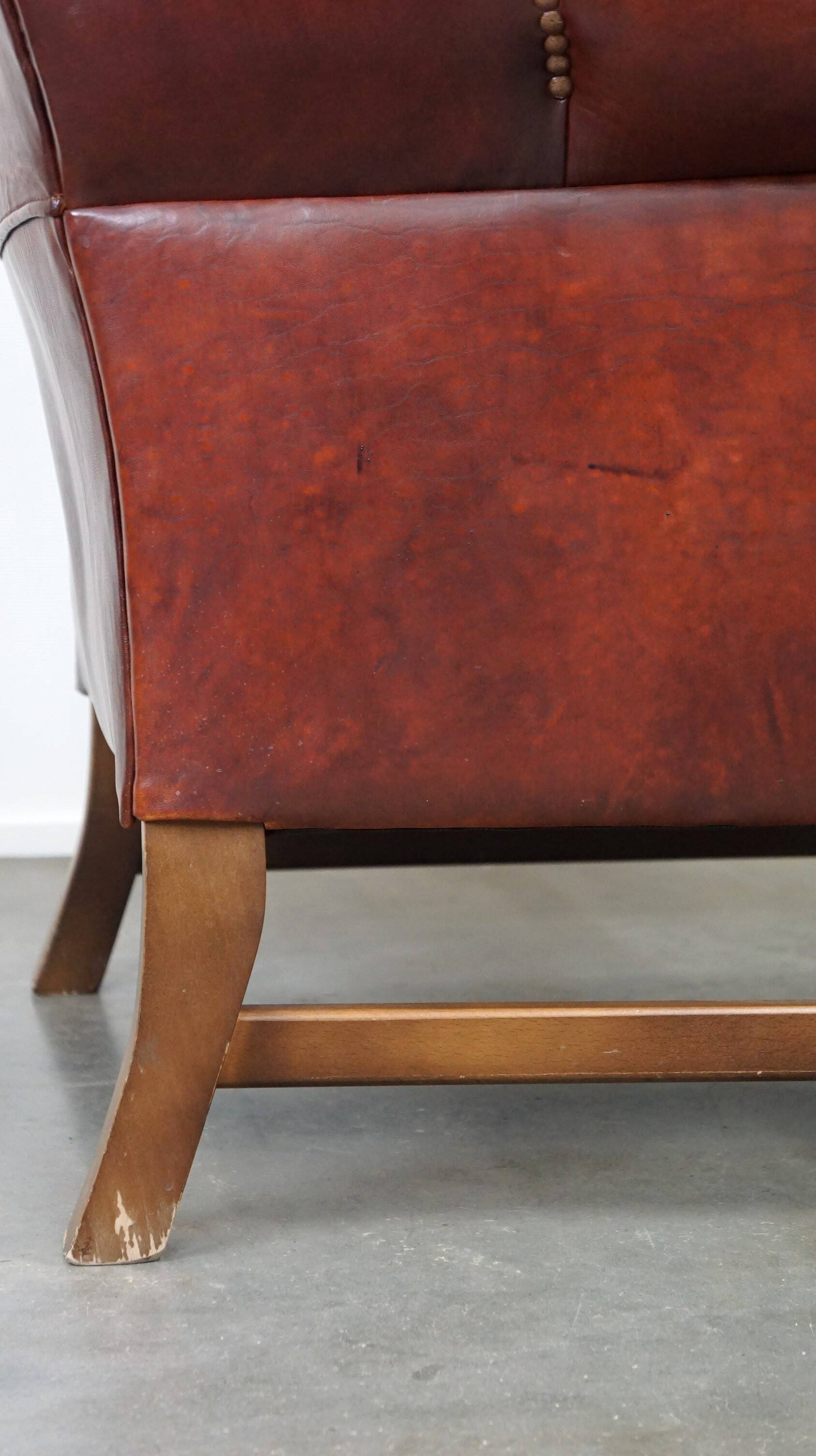 Large comfortable sheepleather wingchair in good condition and beautiful colours